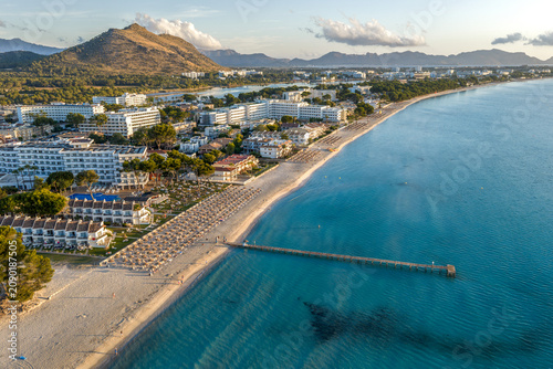 Tableau sur toile Alcudia Beach Mallorca, Spain Drone Aerial of Sandy Shoreline, Hotels, and Turqu