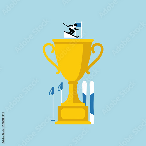 A golden trophy cup stands with winter skiing equipment
