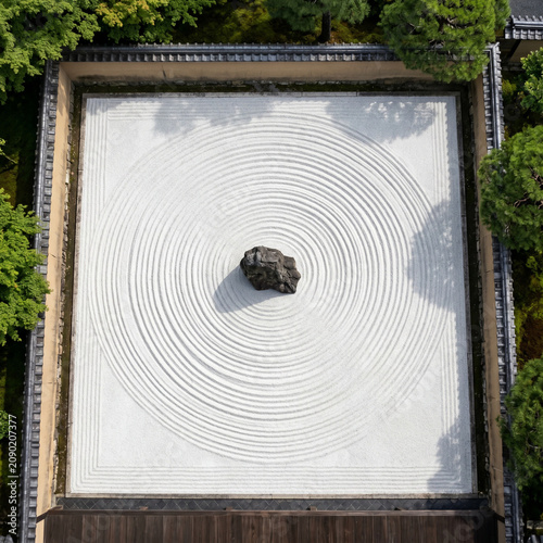 Zen Garden with Raked Sand and Single Rock