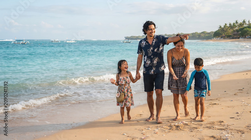 Ultra Realistic Photography of Happy Indonesian Family Enjoying Tropical Beach During School Holidays Vacation