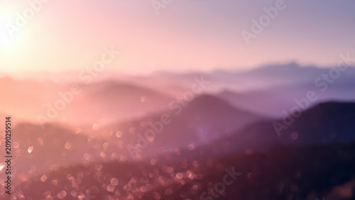 Sunrise Over Misty Mountain Valley and Town.