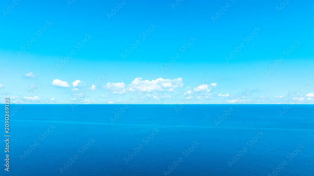 Fototapeta premium Tropical Nature ocean and summer sea water with beautiful bright sunlight. Perfect for summer vacation and travel background 