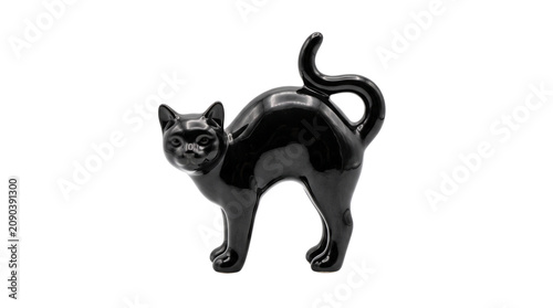 Vintage black ceramic cat figurine, glossy porcelain kitten statue with arched back, retro feline home decor ornament for halloween or collectors isolated PNG with Transparent Background