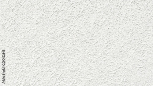 Fotografie Exterior building wall texture with rough three dimensional relief, irregular ar
