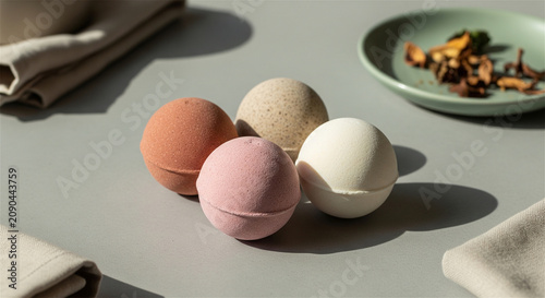 Natural handmade bath bombs in earthy tones, organic spa wellness products on neutral background, aesthetic self-care aromatherapy set