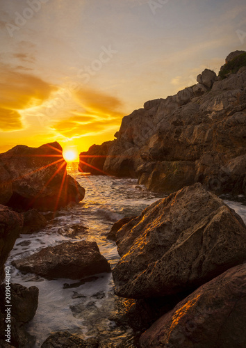 Landscape with a beautiful sunset on a quiet beach