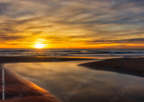 Landscape with a beautiful sunset on a quiet beach