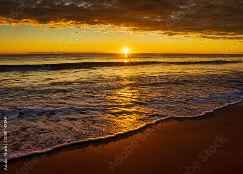 Landscape with a beautiful sunset on a quiet beach