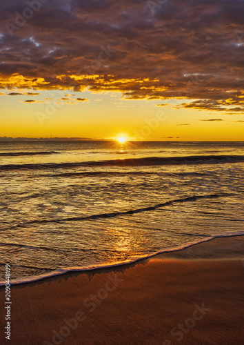 Landscape with a beautiful sunset on a quiet beach