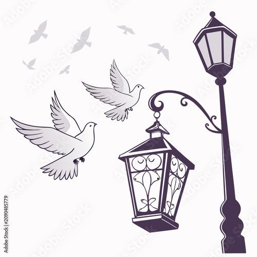 Fotografía A vintage style showing a classic street lamp with ornate ironwork and a flock o