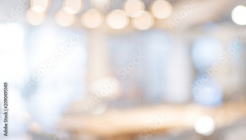 A soft-focus image featuring blurred lights and an interior space, creating a warm ambient atmosphere suitable for backgrounds or overlays.