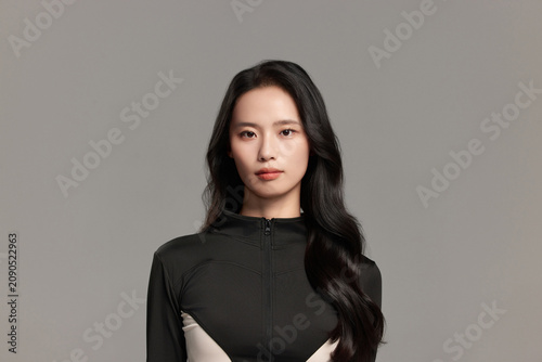 Young Woman in Black Futuristic Outfit