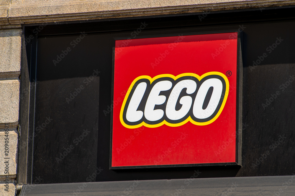 Obraz premium Lego Store Sign on the Wall of a Building with Famous Red and Yellow Brand Logo. Milan, Italy - June 24, 2026