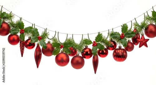 Festive Christmas garland with red ornaments and green pine branches isolated on white.
