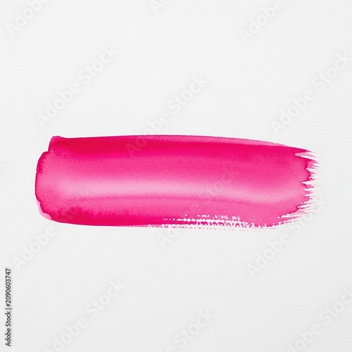 Vibrant hot pink watercolor paint brush stroke isolated on white background.