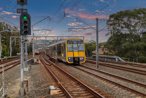 7 July 2026 Passenger Train going through Lewisham Train Station at Sunset a suburban Sydney train Station in Sydney NSW Australia