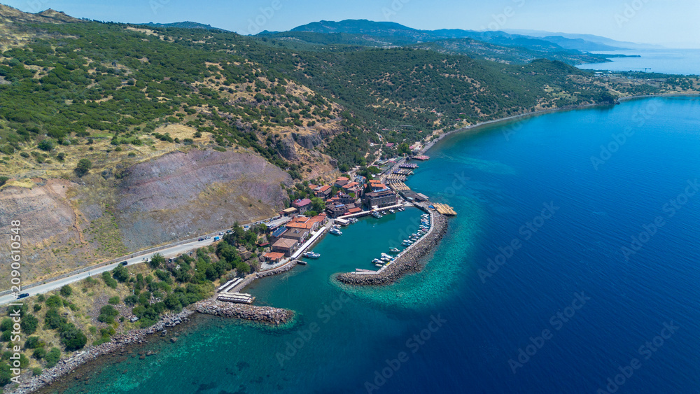 Obraz premium Aerial Drone View of Ancient Assos Harbor and Aegean Sea Coastline Canakkale Turkey