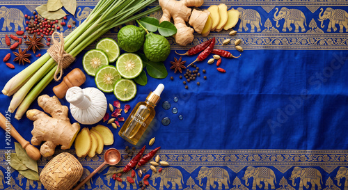 Top down view of Thai herbal compress massage ingredients on silk fabric