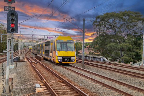 7 July 2026 Passenger Train going through Lewisham Train Station at Sunset a suburban Sydney train Station in Sydney NSW Australia