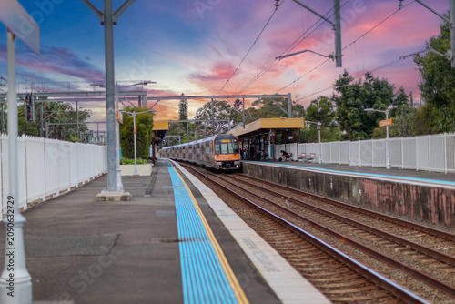 7 July 2026 Passenger Train going through Lewisham Train Station at Sunset a suburban Sydney train Station in Sydney NSW Australia