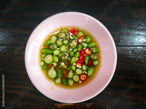 Authentic Nam Pla Prik made with premium fish sauce and freshly sliced chilies.