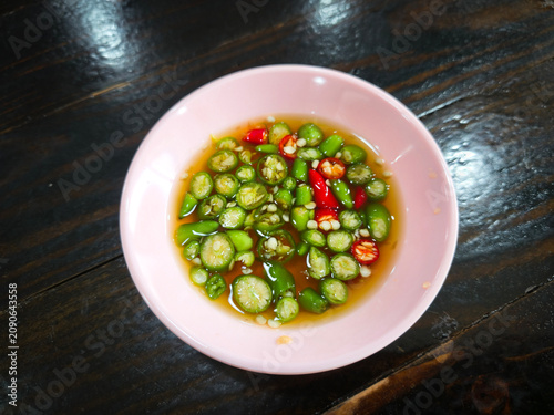 Authentic Nam Pla Prik made with premium fish sauce and freshly sliced chilies.
