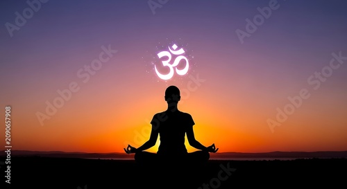 Silhouetted Person Meditating Under Glowing Om Symbol at Sunset