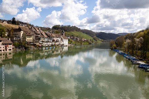 Picturesque riverside village of Eglisau, Switzerland, with historic architecture and boats