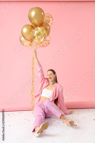 Happy young woman with air ...