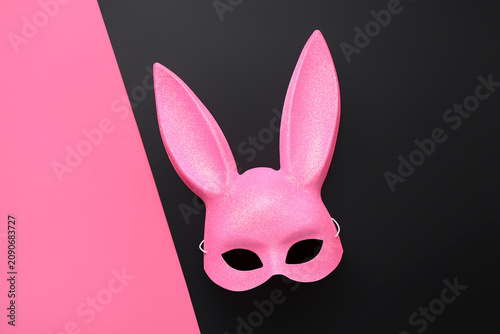 Pink bunny mask on color ba...