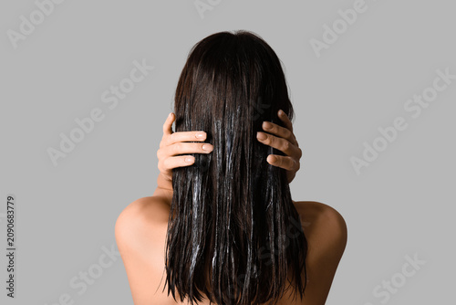Young woman using cosmetics...