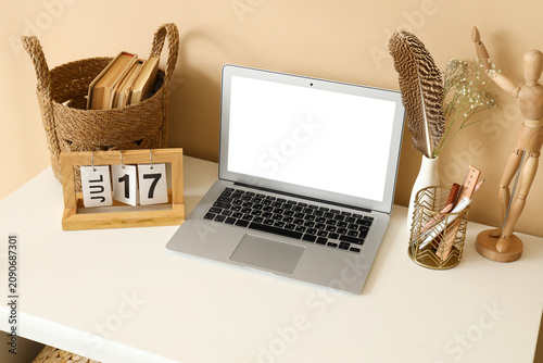 Modern laptop, stationery a...