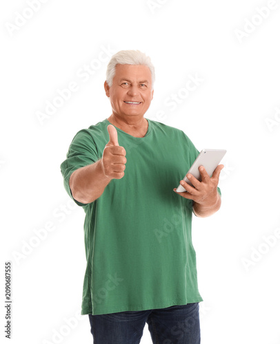 Senior man with tablet comp...