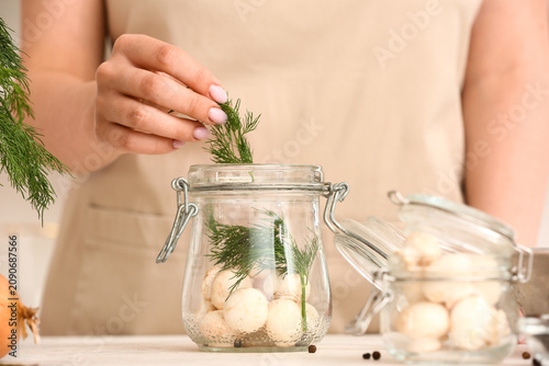 Woman preparing mushrooms f...