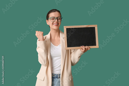 Happy female teacher with c...