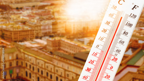 Konstfotografi Heatwave in a city during summer with a thermometer showing high temperatures an