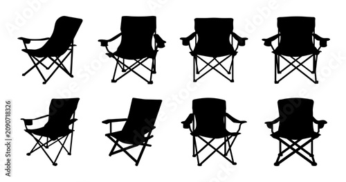 Black folding chairs arranged in rows - Six black folding chairs lined up in two parallel rows against a clean background, ready for use.
