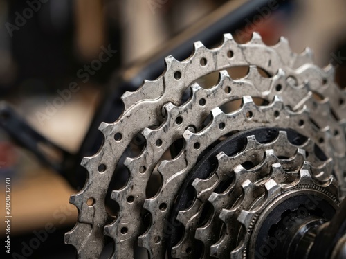 Close Up Metallic Bicycle Rear Cassette Sprocket Cogs with Blurred Background