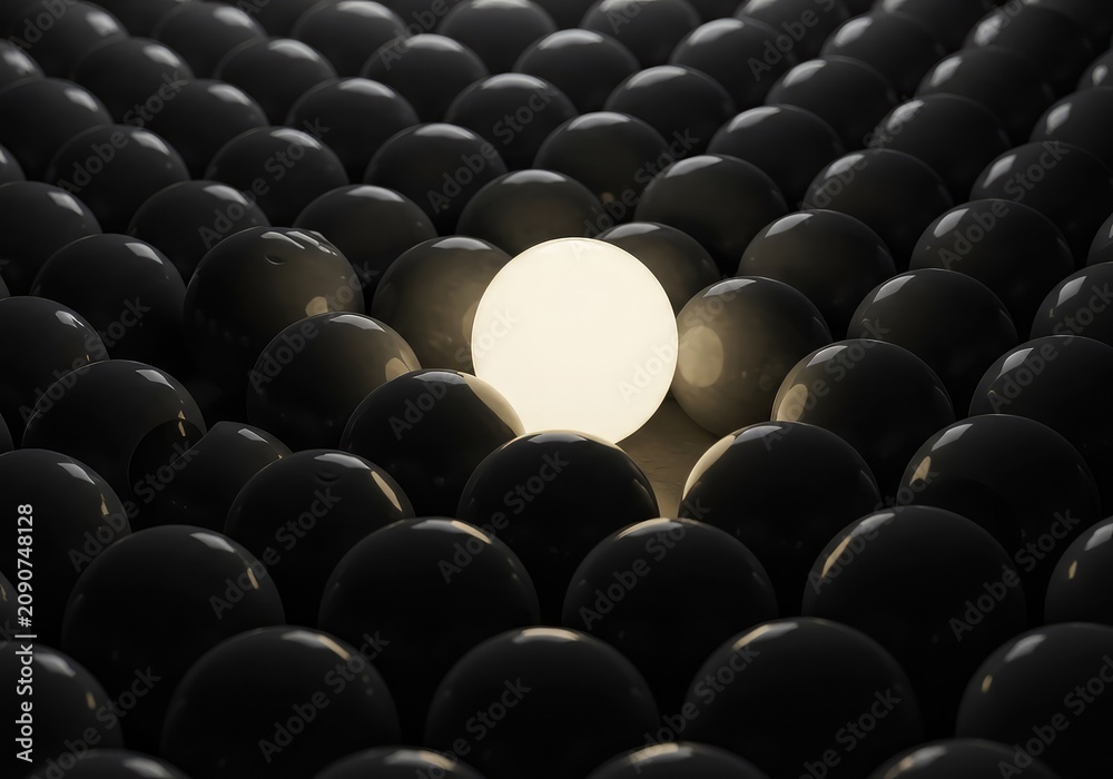 Fototapeta premium A solitary, bright, distinct sphere stands out dramatically from a large, monotonous arrangement of identical gray spheres ,isolated ,concept ,differentiation