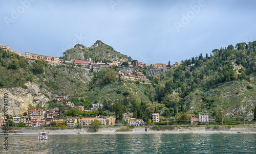 View of Taormina coast and beaches from a boat.
