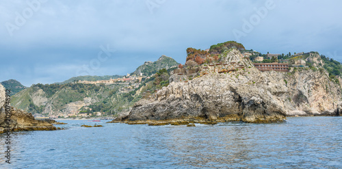 View of Taormina coast and beaches from a boat.