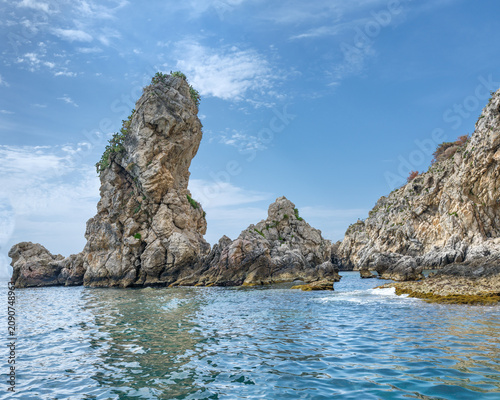 View of Taormina coast and beaches from a boat.