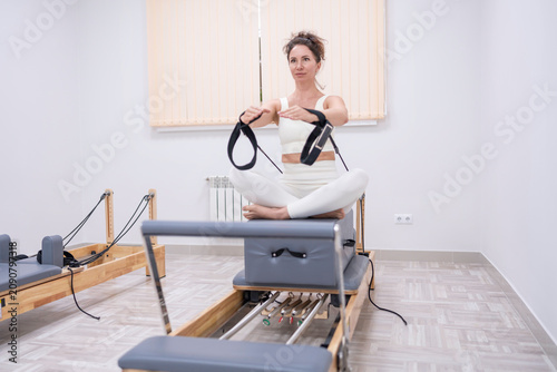 Fotografija Pilates reformer exercise woman practicing core strengthening and posture alignm