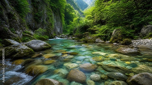 Crystal clear turquoise river flowing over smooth stones through a lush green canyon, sunlit forest gorge with mossy boulders and pristine mountain water in a serene wilderness landscape