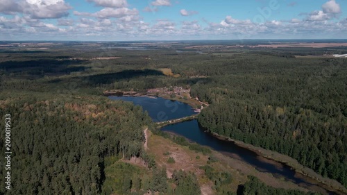 Aerial Drone Flight Over Historic Wooden Village by Lake Surrounded by Forest
