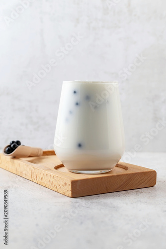 Milkshake with tapioca, bubbly tea on a gray background.