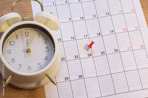 planning, an event or activity is marked in a notebook with a marker.
