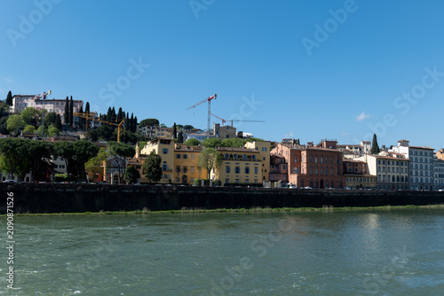 Принти на полотні FLORENCE ITALY APRIL 7 2026: View across the Arno River in Florence with colorful buildings and a bridge in the background