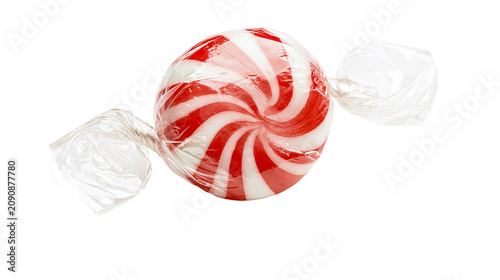 Canvastavla Round red and white striped peppermint candy wrapped in clear plastic, isolated