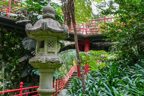 Lush Green Park with Traditional Chinese Architecture under Clear Blue Sky